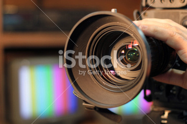 stock-photo-29221078-zooming-video-camera-lens